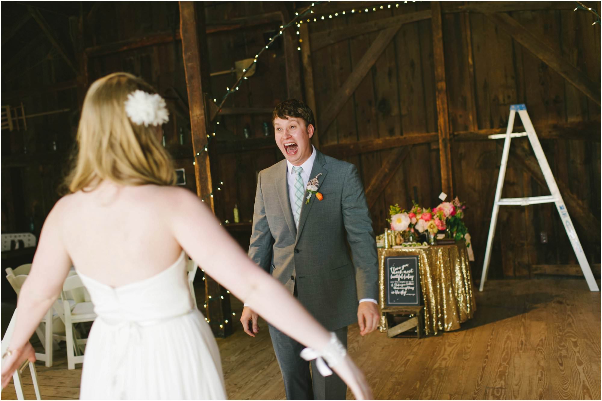 rustic webb barn wedding grooms reaction first look