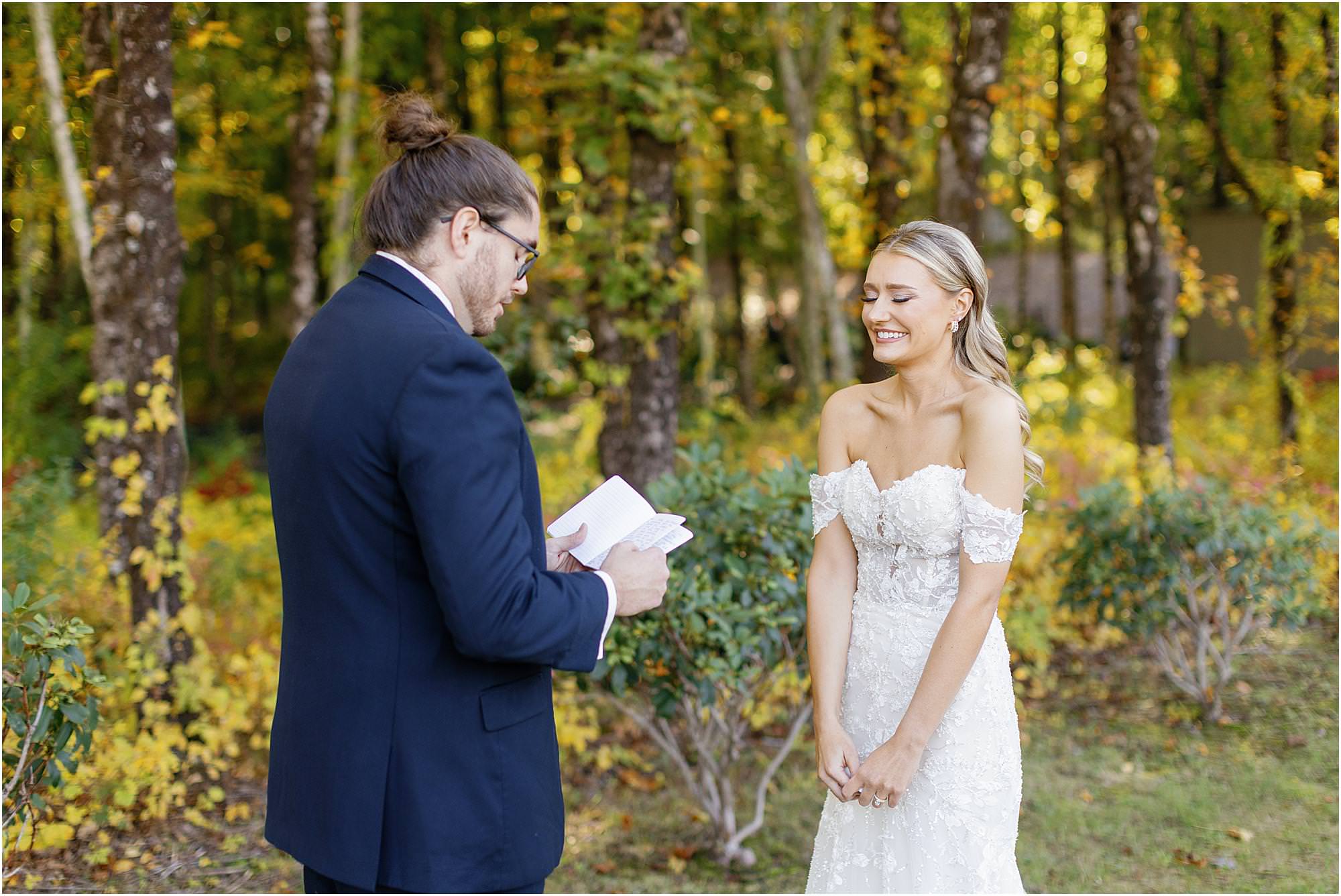 Couple reading each other private vows before their wedding ceremony at their first look